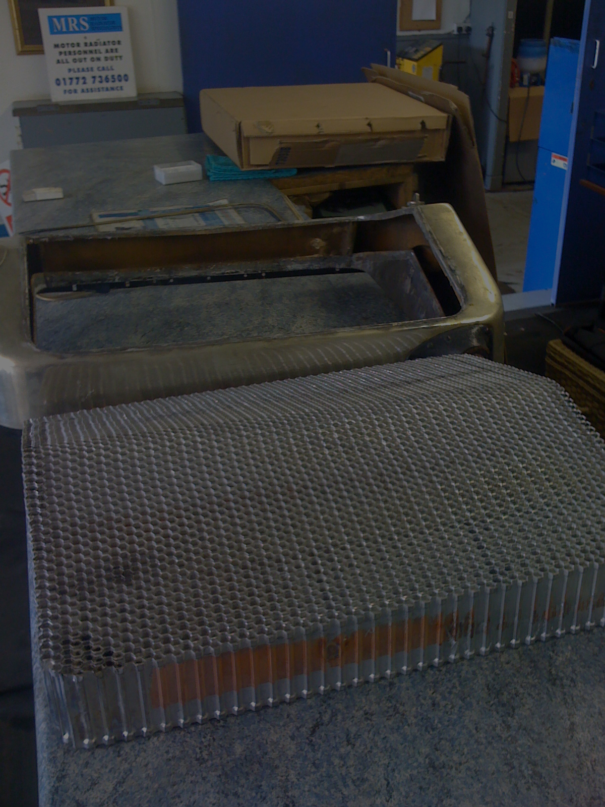 vintage sunbeam radiator being repaired